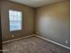 Comfortable bedroom with neutral walls, carpeted floors, and a window with blinds at 36905 W Mattino Ln, Maricopa, AZ 85138