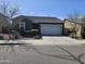 Inviting single-story home with a well-maintained yard, two car garage and desert landscaping at 36905 W Mattino Ln, Maricopa, AZ 85138
