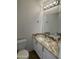 Stylish powder room featuring granite countertops and modern fixtures at 3758 E Ironwood Dr, Phoenix, AZ 85044