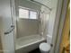 Full bathroom with a shower-tub combo and updated white fixtures at 3758 E Ironwood Dr, Phoenix, AZ 85044