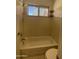 Clean, well-lit bathroom with a tub, shower, and a toilet at 3758 E Ironwood Dr, Phoenix, AZ 85044