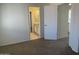 Large, carpeted bedroom with neutral paint and an ensuite bathroom at 3758 E Ironwood Dr, Phoenix, AZ 85044