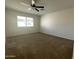 View of a bright bedroom with a large window and neutral carpet at 3758 E Ironwood Dr, Phoenix, AZ 85044