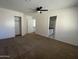 Bedroom with neutral walls, closet, carpet, and an ensuite bathroom at 3758 E Ironwood Dr, Phoenix, AZ 85044