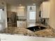 Bright kitchen featuring granite counters, stainless steel appliances, and ample cabinet space at 3758 E Ironwood Dr, Phoenix, AZ 85044
