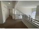 Spacious loft area with carpet and view of the living area below at 3758 E Ironwood Dr, Phoenix, AZ 85044