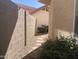 A stone walkway runs between the property and a block wall at 3758 E Ironwood Dr, Phoenix, AZ 85044