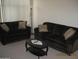 Inviting living room with comfortable sofas and neutral carpet at 3830 E Lakewood Pkwy # 2085, Phoenix, AZ 85048