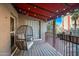 Cozy balcony featuring a comfortable egg chair, string lights, and sunny exterior views at 387 N 2Nd Ave # 2E, Phoenix, AZ 85003