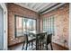 Charming dining area with exposed brick walls and an abundance of natural light at 387 N 2Nd Ave # 2E, Phoenix, AZ 85003