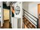 Stylish entryway featuring a modern staircase, a round mirror, and ample storage at 387 N 2Nd Ave # 2E, Phoenix, AZ 85003
