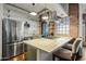 Modern kitchen featuring stainless steel appliances, a gas cooktop, and a beautiful exposed brick wall at 387 N 2Nd Ave # 2E, Phoenix, AZ 85003