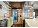 Modern kitchen featuring a white countertop, stainless appliances, and brick accents at 387 N 2Nd Ave # 2E, Phoenix, AZ 85003