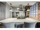 Bright kitchen with an island cooktop, modern stainless steel appliances, and sleek countertops at 387 N 2Nd Ave # 2E, Phoenix, AZ 85003
