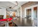 Comfortable living room with views to the kitchen, featuring a stylish dining area and modern staircase at 387 N 2Nd Ave # 2E, Phoenix, AZ 85003