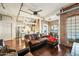 Spacious open-concept interior featuring hardwood floors, leather sofa, and kitchen view at 387 N 2Nd Ave # 2E, Phoenix, AZ 85003