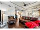 Open-concept interior featuring hardwood floors, a comfortable leather sofa, and kitchen view at 387 N 2Nd Ave # 2E, Phoenix, AZ 85003