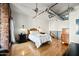 Airy main bedroom with hardwood floors, exposed ductwork, and a serene atmosphere at 387 N 2Nd Ave # 2E, Phoenix, AZ 85003