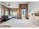 Bright main bedroom showcasing exposed brick, city views, and a comfortable sitting area at 387 N 2Nd Ave # 2E, Phoenix, AZ 85003