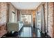 Inviting sitting area with exposed brick, stylish decor, and cityscape views at 387 N 2Nd Ave # 2E, Phoenix, AZ 85003