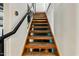 Wooden staircase with metal railings leading to the upper level at 387 N 2Nd Ave # 2E, Phoenix, AZ 85003