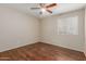 Bedroom featuring hardwood floors, natural light, and a ceiling fan at 3901 W Davidson Ln, Phoenix, AZ 85051