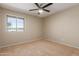 Bedroom with natural light, ceiling fan, and plush carpet at 3901 W Davidson Ln, Phoenix, AZ 85051