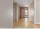 Bright entryway featuring tile flooring, neutral paint, and a pink front door with security screen at 3901 W Davidson Ln, Phoenix, AZ 85051