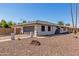Charming single-story home with a two-car garage, a fenced yard, and desert landscaping at 3901 W Davidson Ln, Phoenix, AZ 85051