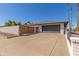 A driveway leads to a charming single-story home with a two-car garage at 3901 W Davidson Ln, Phoenix, AZ 85051