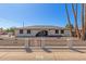 Charming single-story home featuring an arched entryway and low decorative fence at 3901 W Davidson Ln, Phoenix, AZ 85051