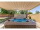 Relaxing hot tub featuring sparkling blue water and adjustable spa jets at 3901 W Davidson Ln, Phoenix, AZ 85051