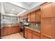 Updated kitchen with stainless steel appliances, granite countertops, and sleek cabinetry at 3901 W Davidson Ln, Phoenix, AZ 85051