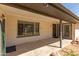 Covered brick patio with backyard view, featuring access to the main house at 3901 W Davidson Ln, Phoenix, AZ 85051