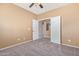 Empty bedroom with carpet and a view of another room at 41800 W Chambers Ct, Maricopa, AZ 85138