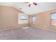 Large bedroom with carpet, neutral walls, and vaulted ceiling at 41800 W Chambers Ct, Maricopa, AZ 85138