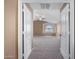 View into a neutral bedroom with carpeted floor, vaulted ceiling and ceiling fan at 41800 W Chambers Ct, Maricopa, AZ 85138