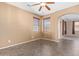 Inviting dining room featuring tiled flooring, neutral walls, and an archway entrance at 41800 W Chambers Ct, Maricopa, AZ 85138