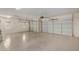 Spacious garage with three garage doors, providing ample parking and storage space at 41800 W Chambers Ct, Maricopa, AZ 85138