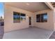 Covered patio offers a relaxing outdoor space accessible through a door and windows at 41800 W Chambers Ct, Maricopa, AZ 85138
