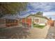 Large backyard with gravel, artificial turf, hammock, and raised garden bed at 44715 W Paitilla Ln, Maricopa, AZ 85139