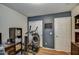 Bedroom featuring a workout machine, closet, and wood floors at 44715 W Paitilla Ln, Maricopa, AZ 85139