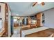 Dining area with hardwood floors and views into the kitchen and living spaces at 44715 W Paitilla Ln, Maricopa, AZ 85139