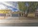 Well-kept single-story home featuring a two-car garage, desert landscaping, and convenient street access at 44715 W Paitilla Ln, Maricopa, AZ 85139