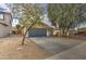 Charming single-story home featuring a two-car garage and low-maintenance desert landscaping at 44715 W Paitilla Ln, Maricopa, AZ 85139
