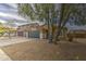 Lovely single-story home featuring a two-car garage, desert landscaping, and adjacent neighborhood views at 44715 W Paitilla Ln, Maricopa, AZ 85139