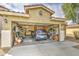 Garage featuring a car and storage shelves at 44715 W Paitilla Ln, Maricopa, AZ 85139