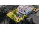 Aerial view of a backyard highlighted with a patio, green lawn, and outdoor seating areas at 549 W Sweet Shrub Ave, Queen Creek, AZ 85140