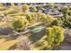 Aerial view of a community basketball court, surrounded by trees and grass at 549 W Sweet Shrub Ave, Queen Creek, AZ 85140