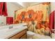 Bathroom featuring a floral shower curtain, vanity sink, and mirrored wall at 549 W Sweet Shrub Ave, Queen Creek, AZ 85140